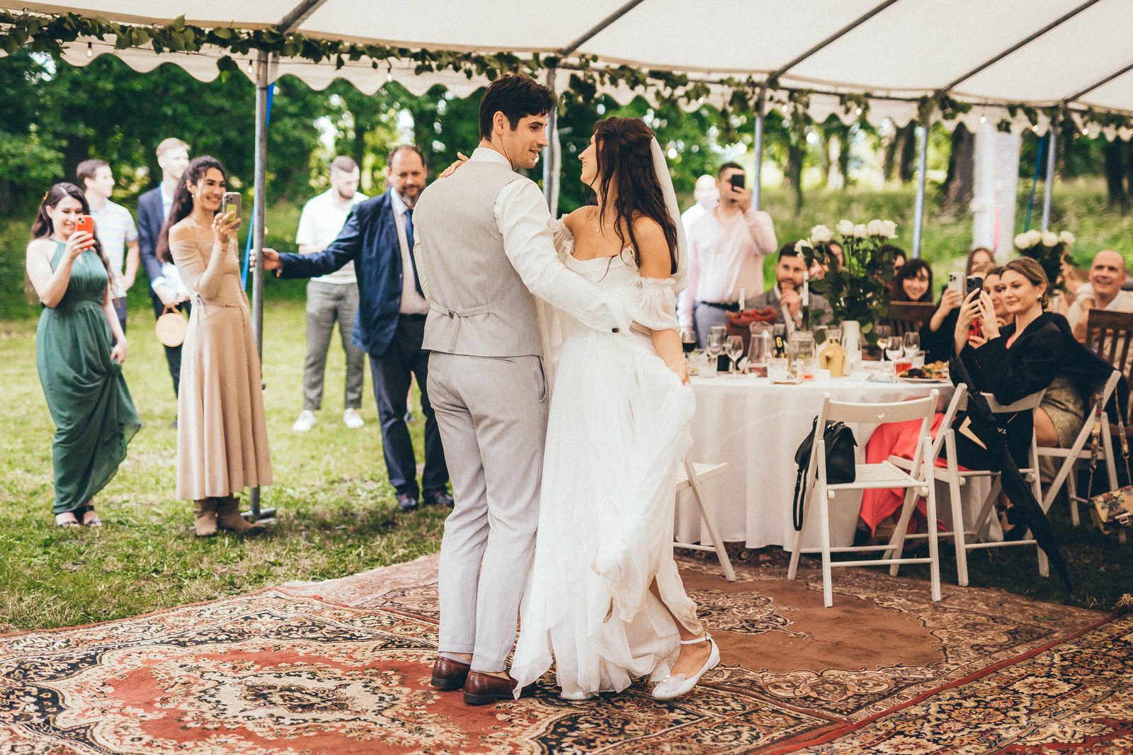 Wedding reception under a tent at Padure Manor, set table and dancing couple
